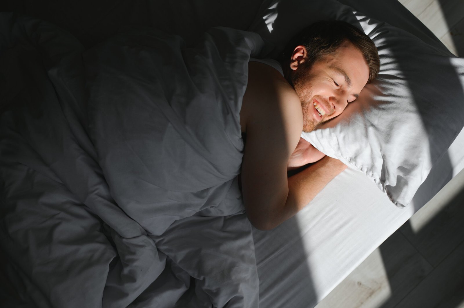 man relaxing in bed