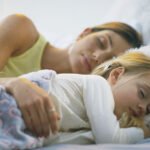 woman and child sleeping comfortably