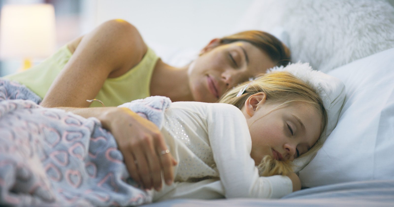 woman and child sleeping comfortably