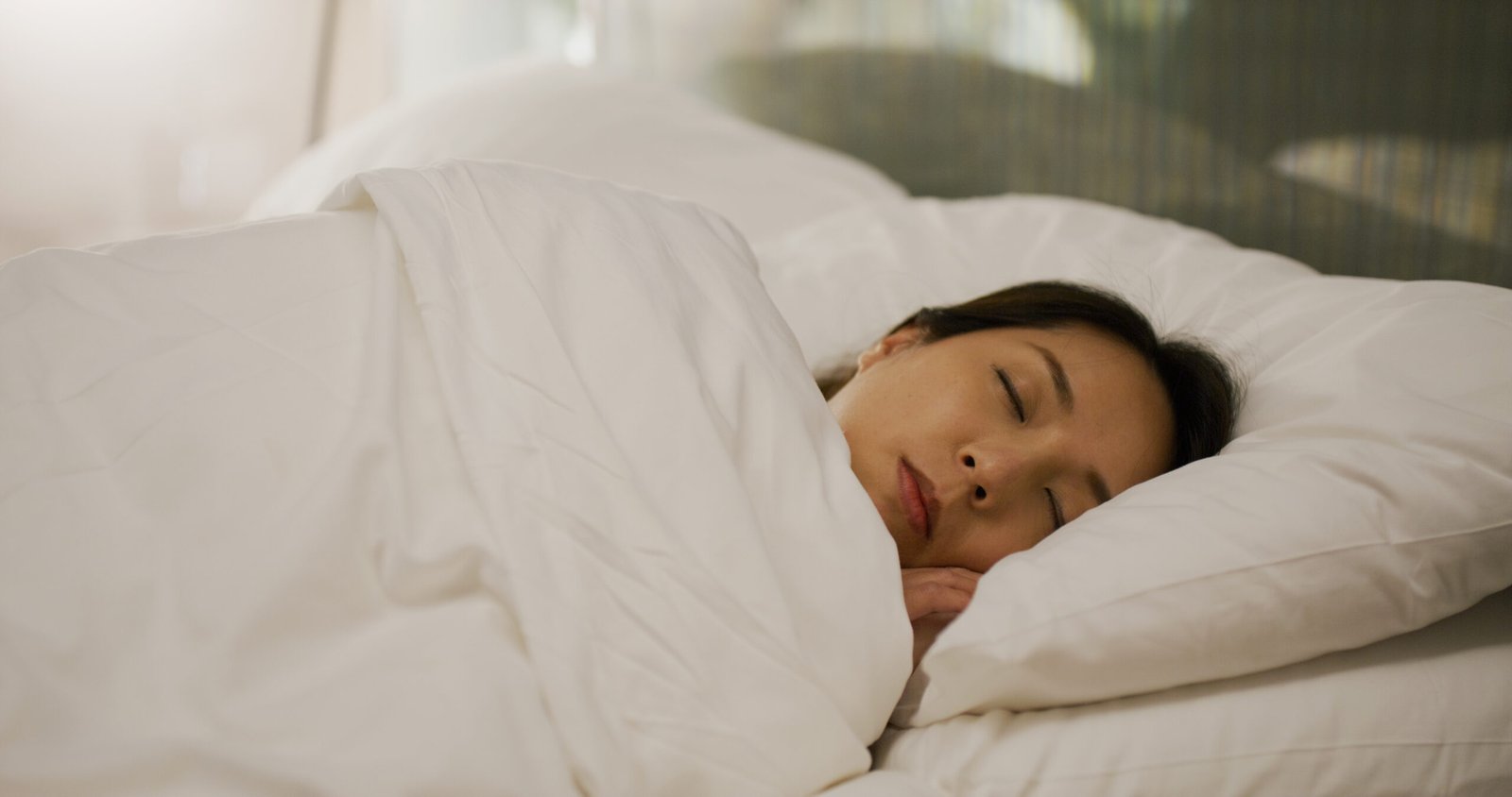 woman sleeping peacefully in a bed