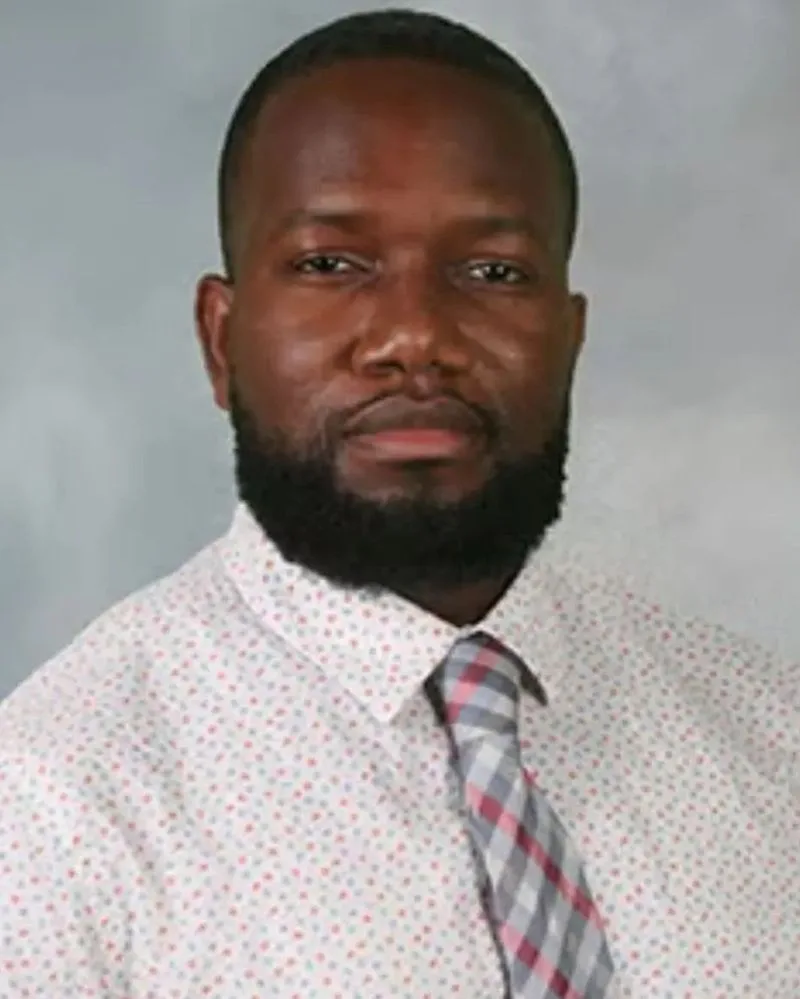Dr. Adekunle Ajisebutu, sleep physician, in a white shirt and patterned tie